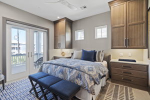 Secondary Bedroom w/ ample space, storage & a private balcony.