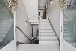 Grand entrance w/ double doors.