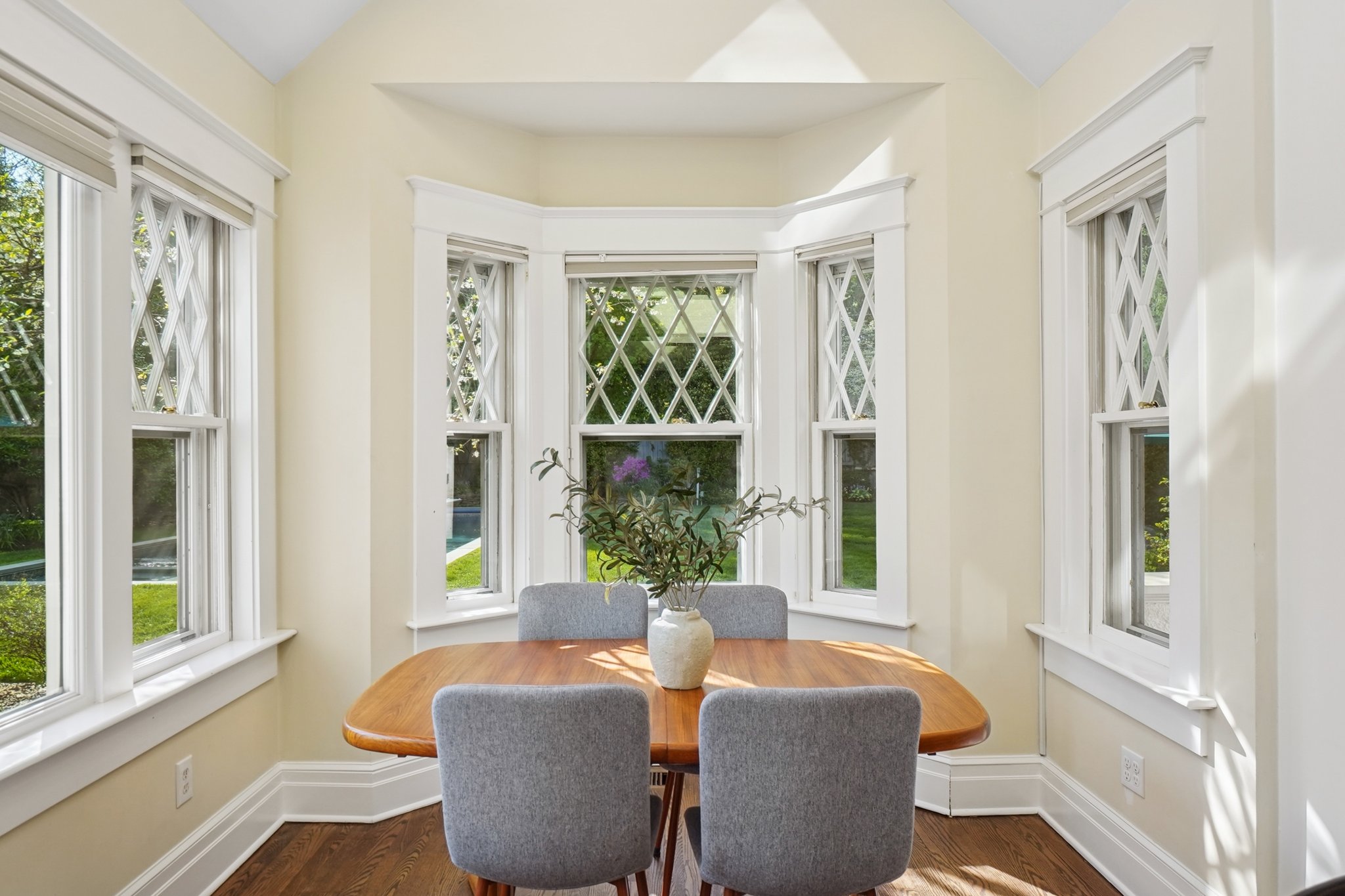The kitchen's eating nook is a great place to gather for meals, homework or crafts, all while overlooking the sparkling pool. Skylights above for star gazing!