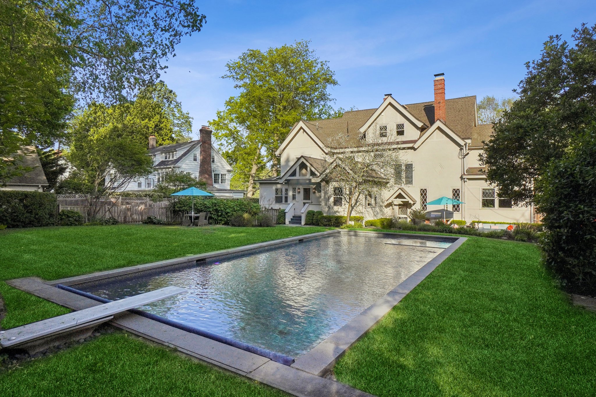 A private resort in the heart of Montclair. With a sparkling Waterworks-tiled pool, lush green lawn, and timeless architecture as the backdrop, this backyard is pure magic—perfect for summer gatherings, morning swims, or golden hour lounging.