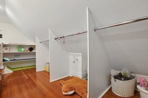 There are two walk-in closets in the primary. One is adjacent to the bath, this second is up a secret flight of stairs. Currently used as a whimsical kids’ clubhouse.