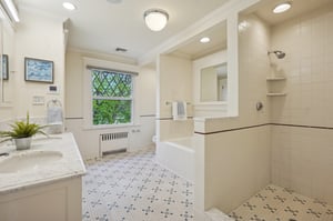 Bedroom #3 ensuite bath with shower and tub.