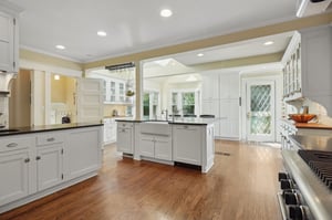 A true chef’s kitchen—expansive and open—features high-end appliances and a generous layout perfect for cooking with helpers and without!