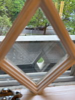 Diamond-paned windows aren’t just pretty—they’re a hallmark of Queen Anne charm!