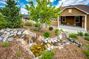 Beautiful Waterfall Feature in Open Space Backyard