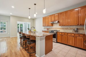 Kitchen w/ Large Center Island and Ample Cabinetry