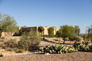 Front Exterior Garage Side/Lot extends to left of driveway