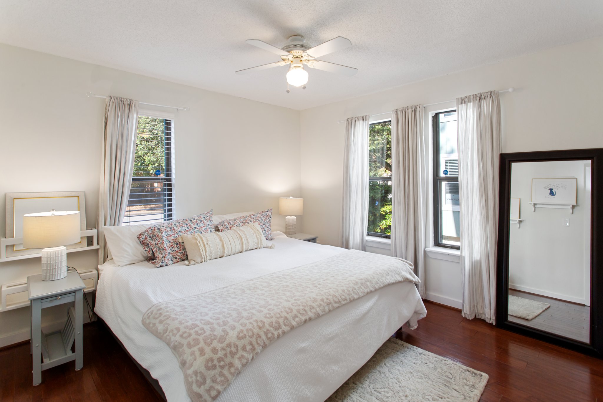 Large downstairs bedroom, one of four total bedrooms in the home