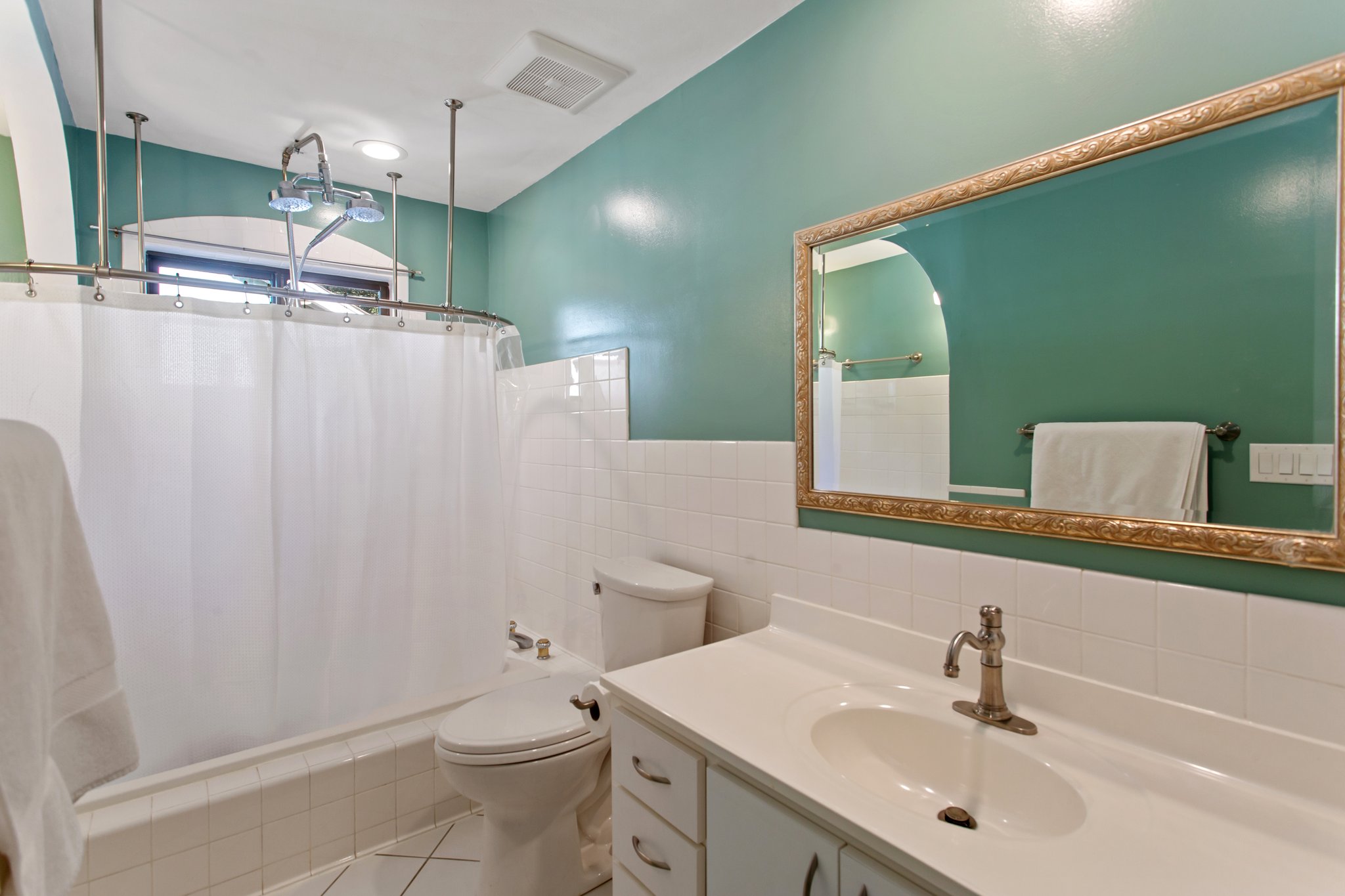 Refreshed primary bathroom complete with a jetted tub