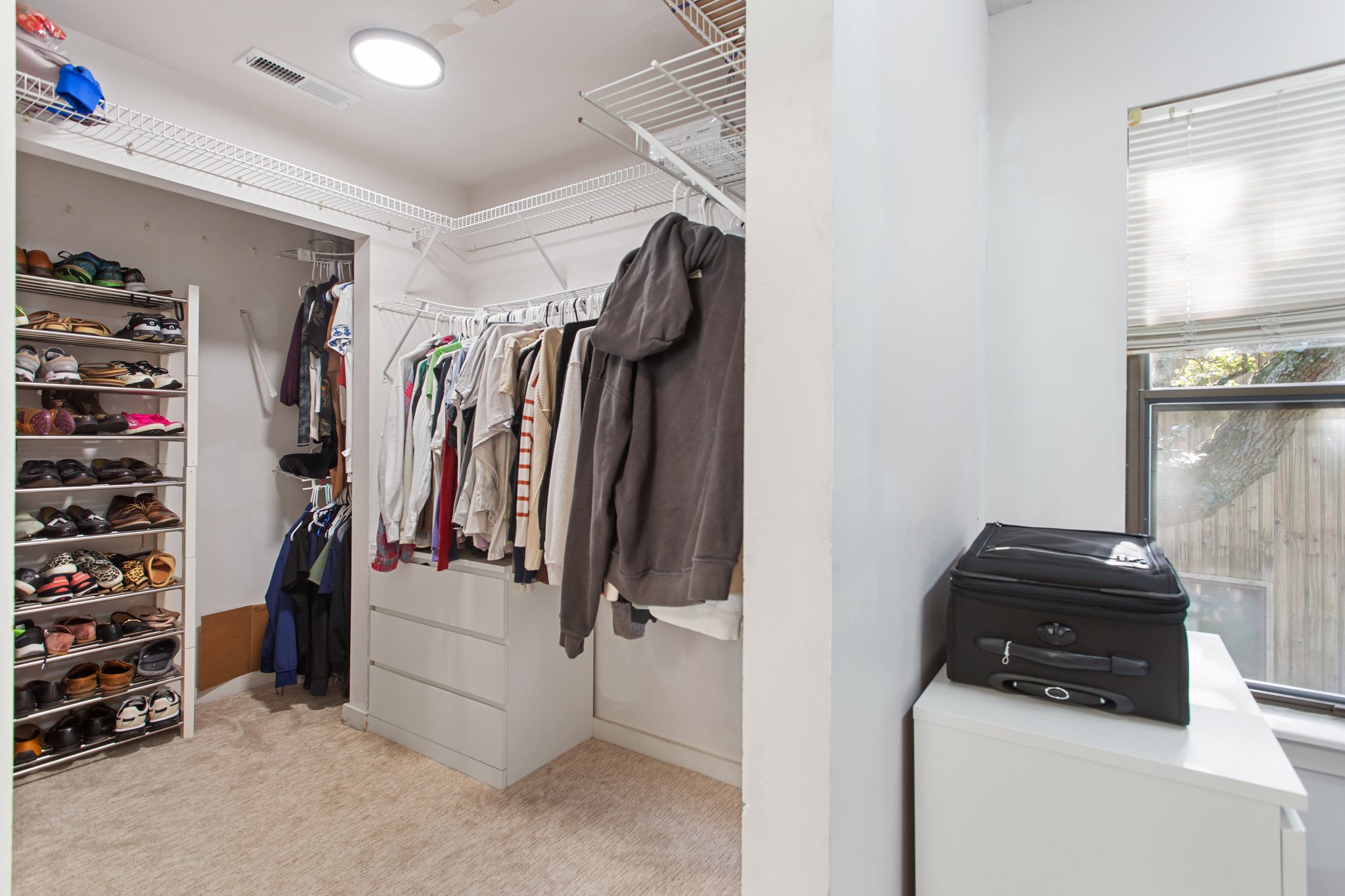 Oversized primary closet with endless storage possibilities