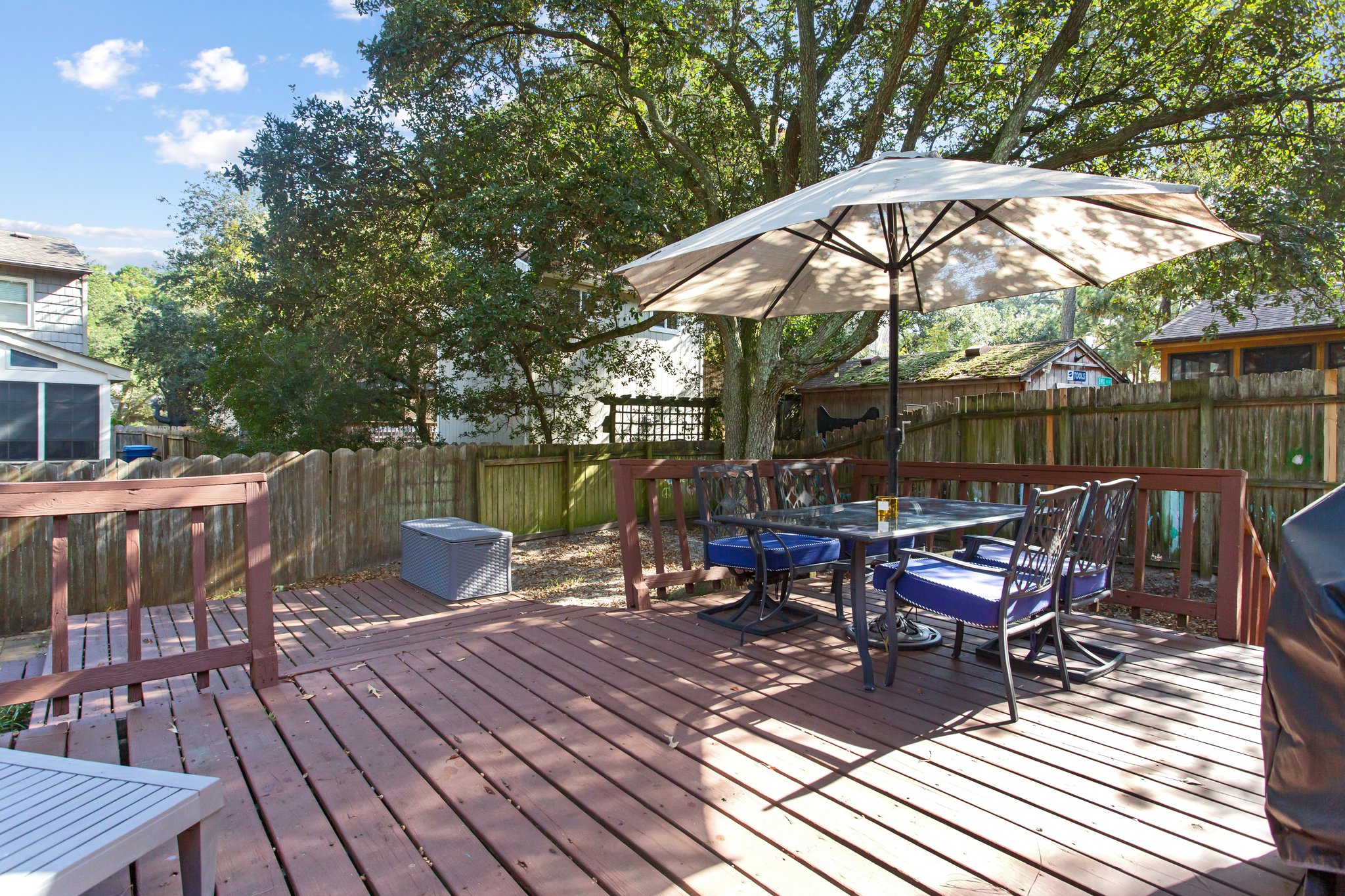 Inviting backyard and deck, perfect for relaxing after a day at the beach