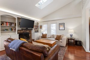 Elegant built-in bookshelves and cozy gas fireplace