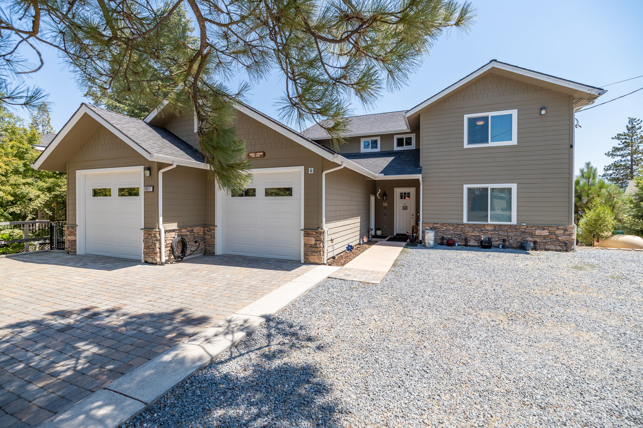 Front of Home With Additional Gravel Parking