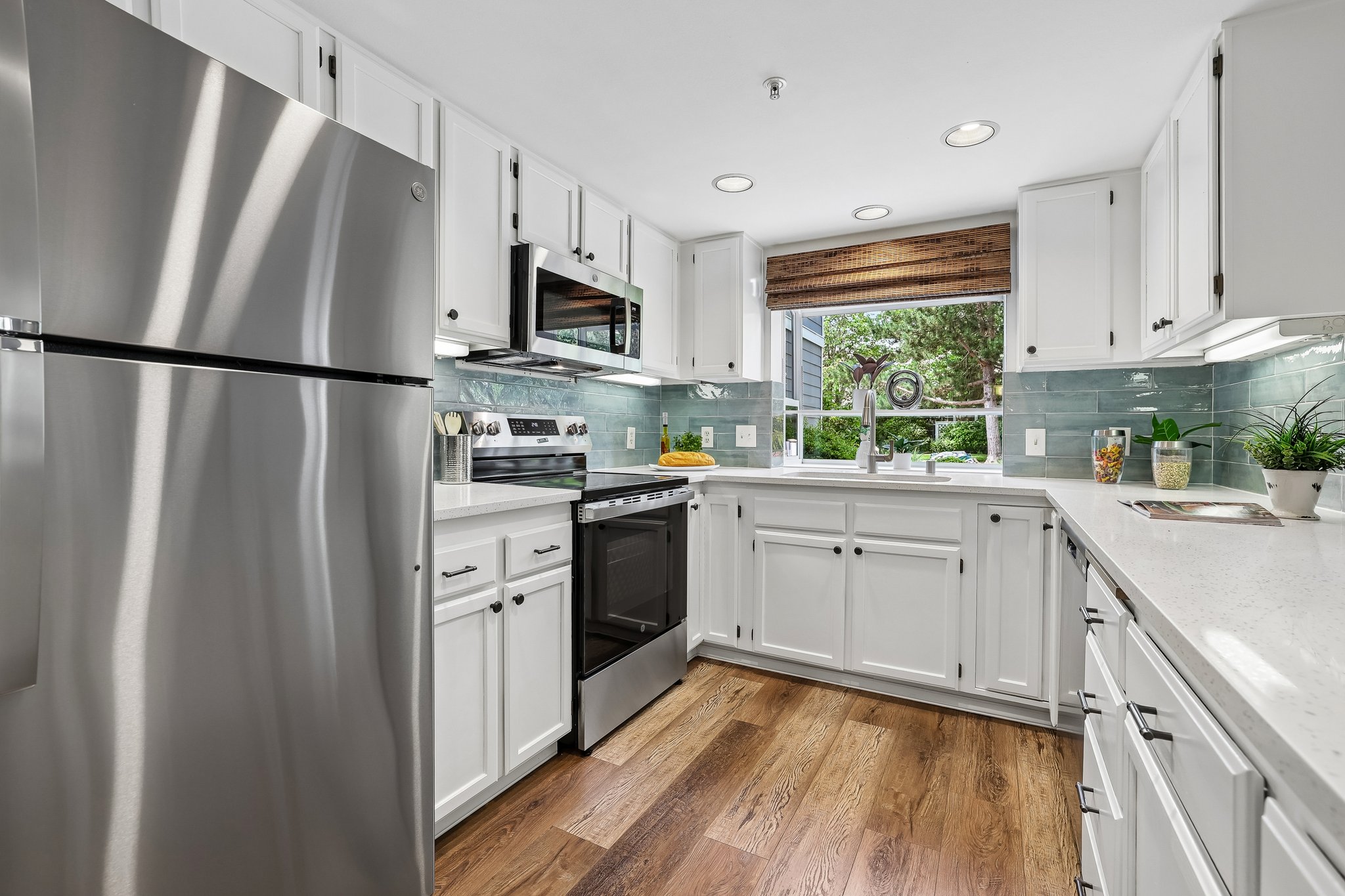 NEW appliances,updated backsplash, freshly painted cabinetry.