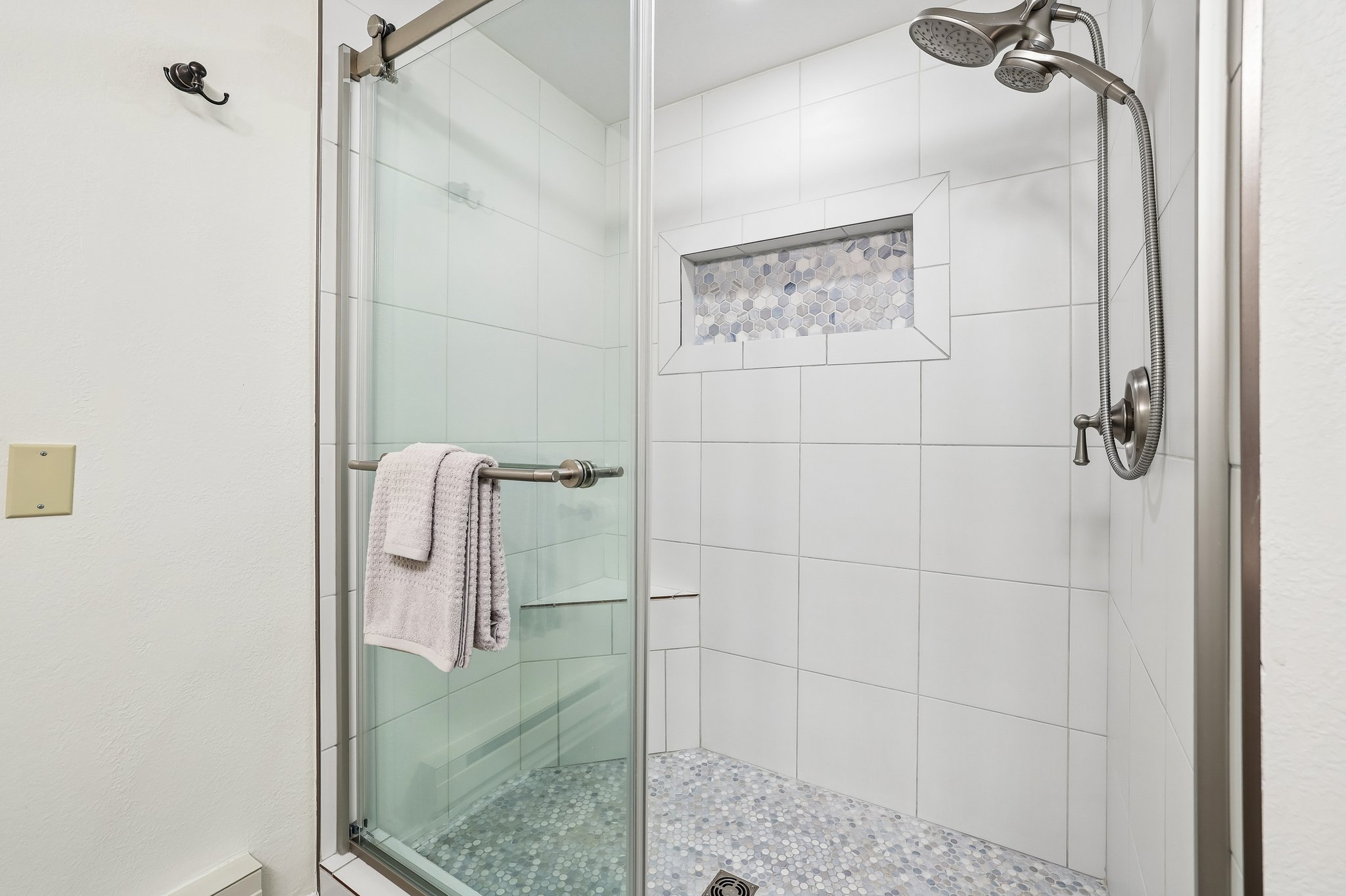 Shower with light blue and whites.