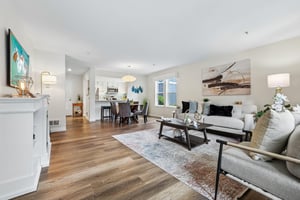 Enter lower level condo with newer windows, plank floors and open spaces