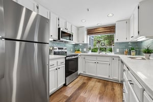 NEW appliances,updated backsplash, freshly painted cabinetry.