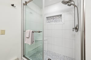 Shower with light blue and whites.