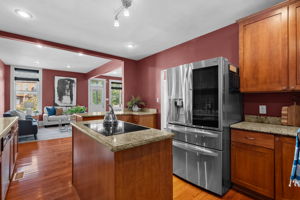 The chef's kitchen conveys with all of the stainless steel appliances.