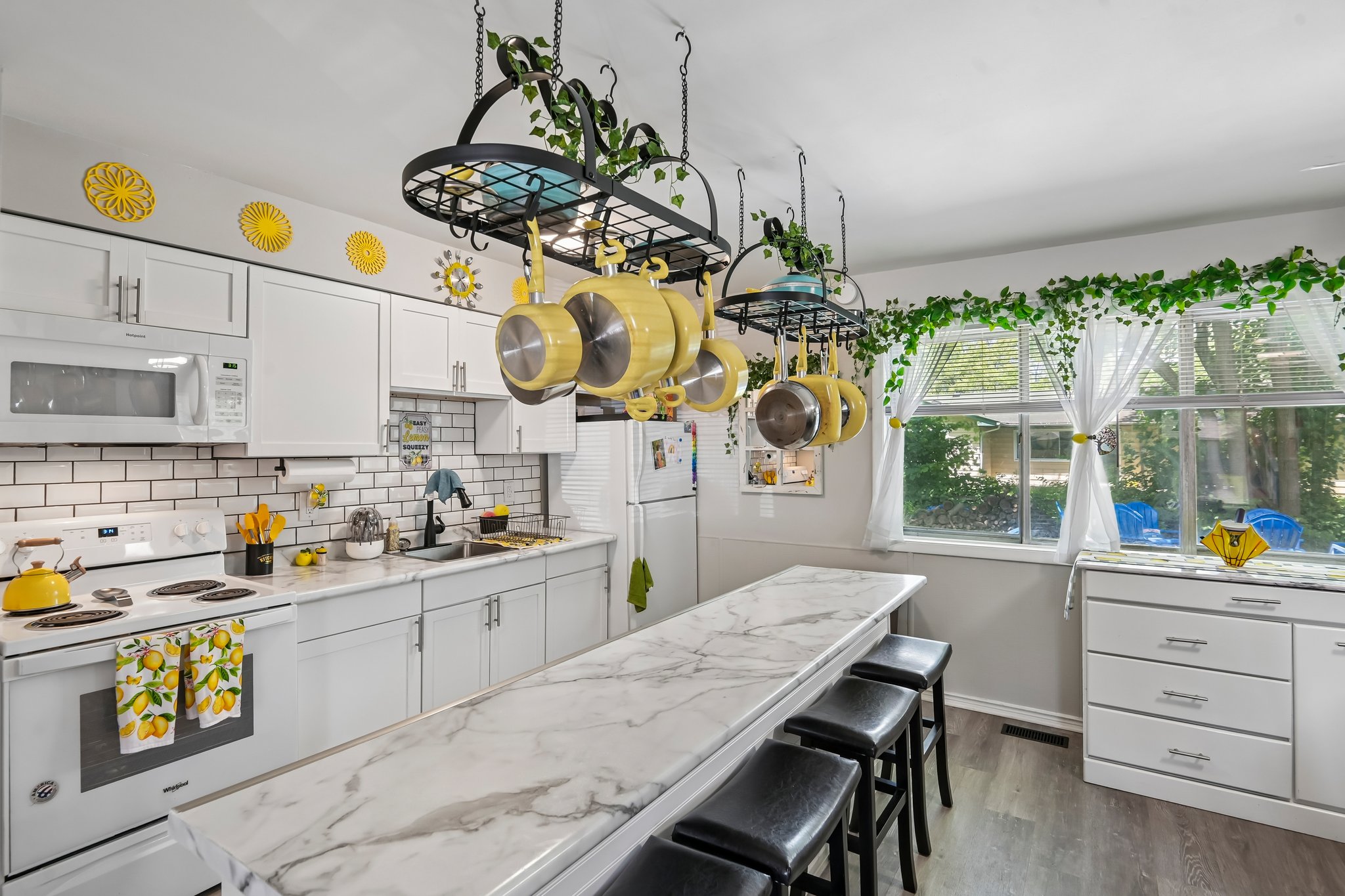Open kitchen, lots of cabinets and counters