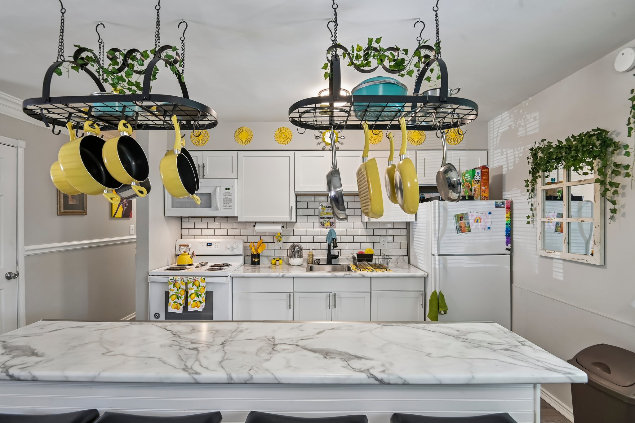 Island is great for prep work or as eat-in area. Pot racks stay
