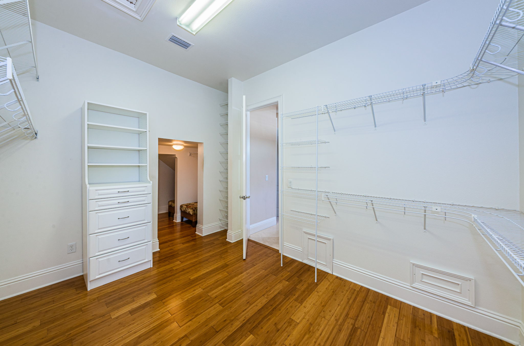 Primary Bedroom Walk-in Closet10a