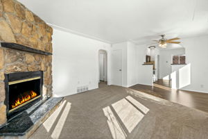 Living Room w/ Gas Fireplace & Dining Room