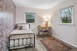 Corner bedroom 2 another great view of the trees and nature outside.