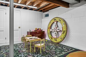 Post-war homes were built for leisure - ping-pong tables, homework hubs, hobby rooms. This oversized rec space continues that legacy. Game night. Peloton zone. Art studio. The flexibility is so very mid-century: form follows fun.