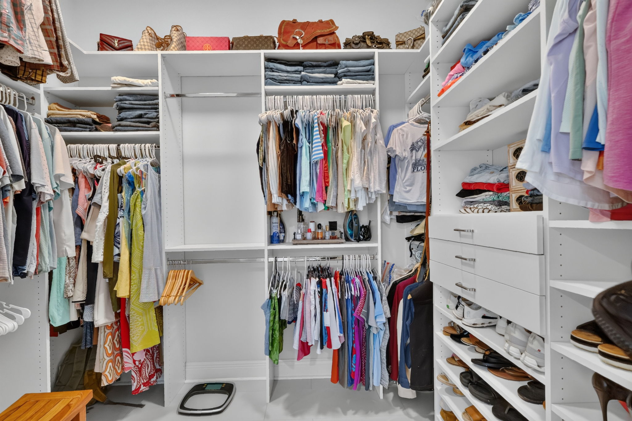 Primary Bedroom Closet with Custom Cabinetry