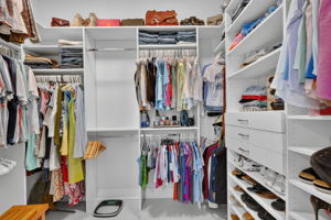 Primary Bedroom Closet with Custom Cabinetry