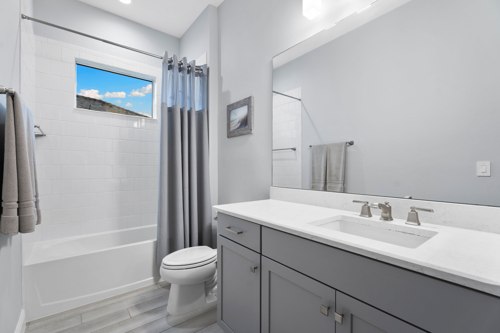 Beautiful guest bathroom with picture window to allow for natural light