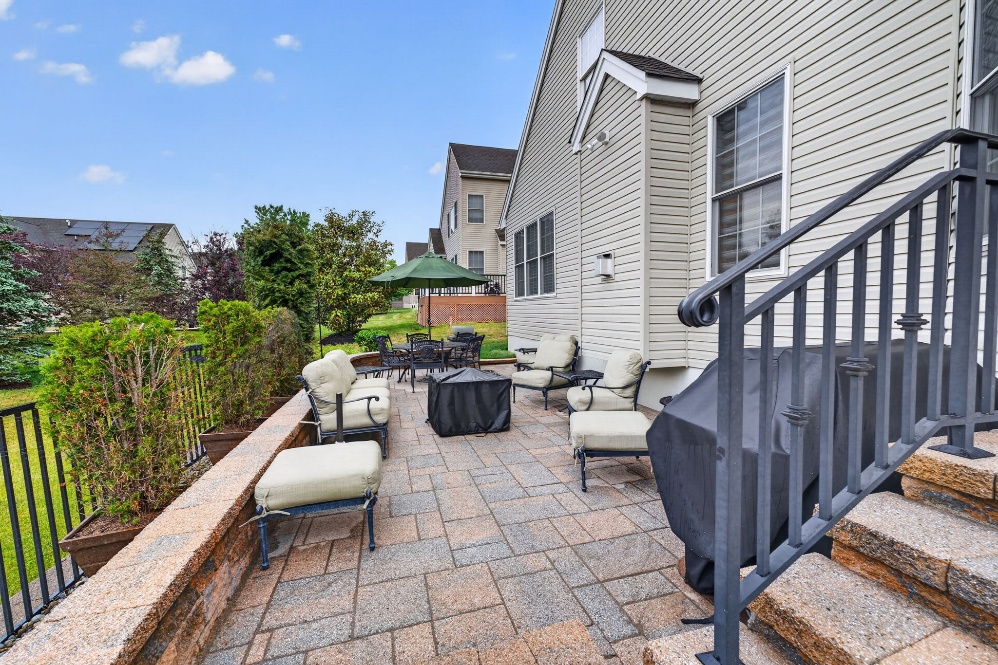 Paver Patio Enjoy your quiet morning coffee on the extended paver patio with block wall and wrought iron railing.