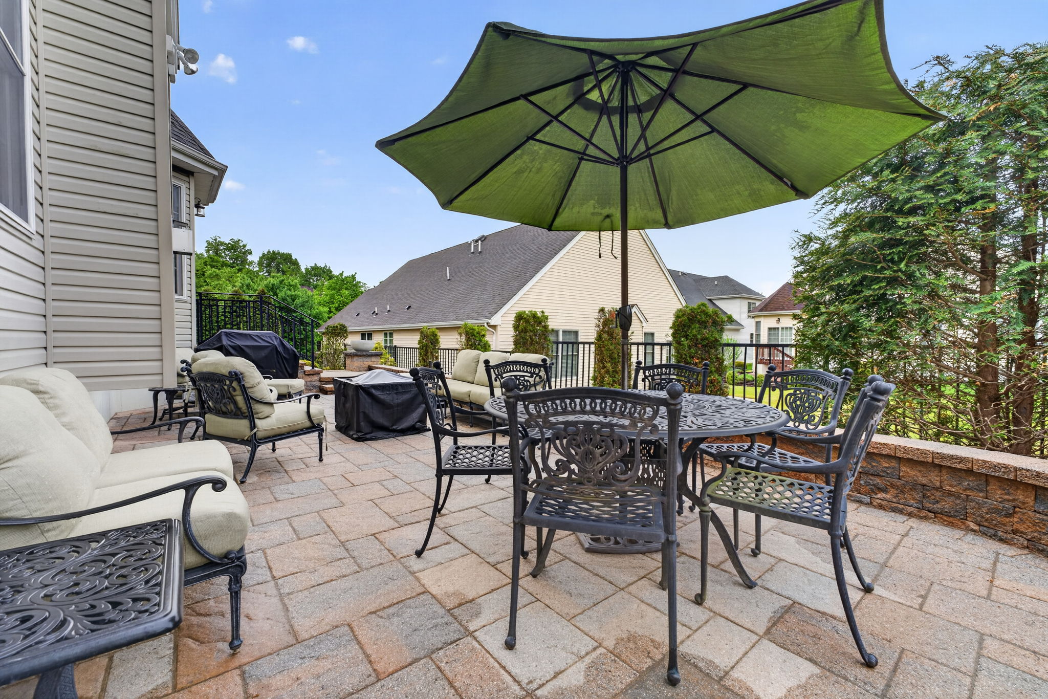 Paver Patio Enjoy your quiet morning coffee on the extended paver patio with block wall and wrought iron railing.