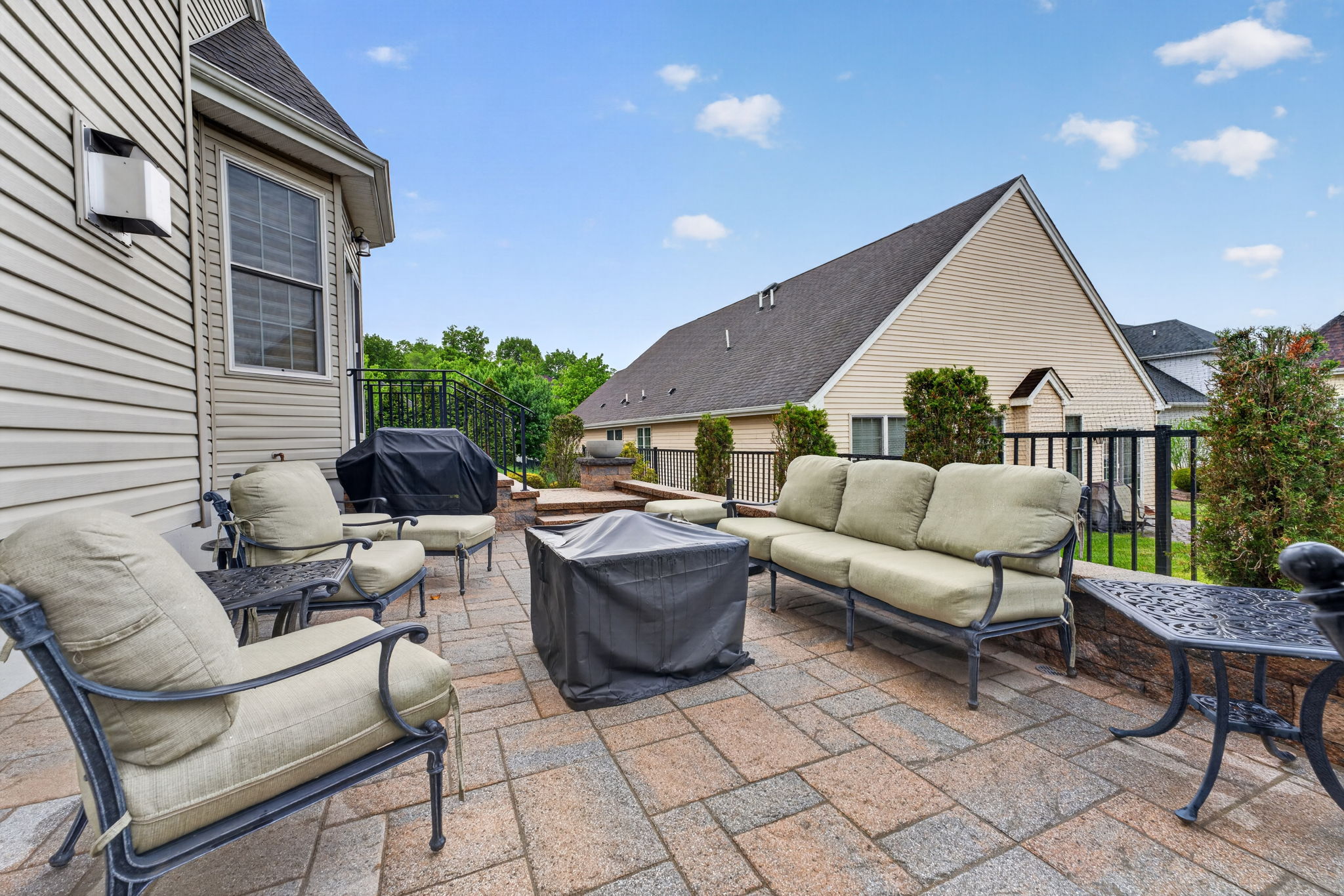 Paver Patio Enjoy your quiet morning coffee on the extended paver patio with block wall and wrought iron railing.