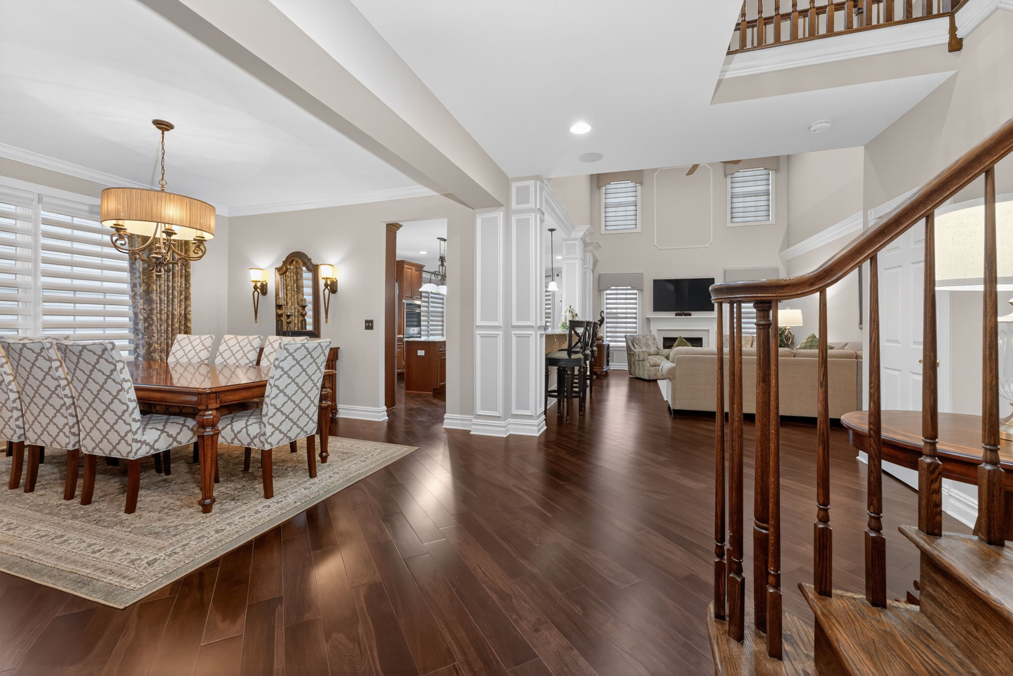 The foyer features a double door closet and hardwood flooring that flows through to the living room, dining room, kitchen, breakfast nook, family room, and study.