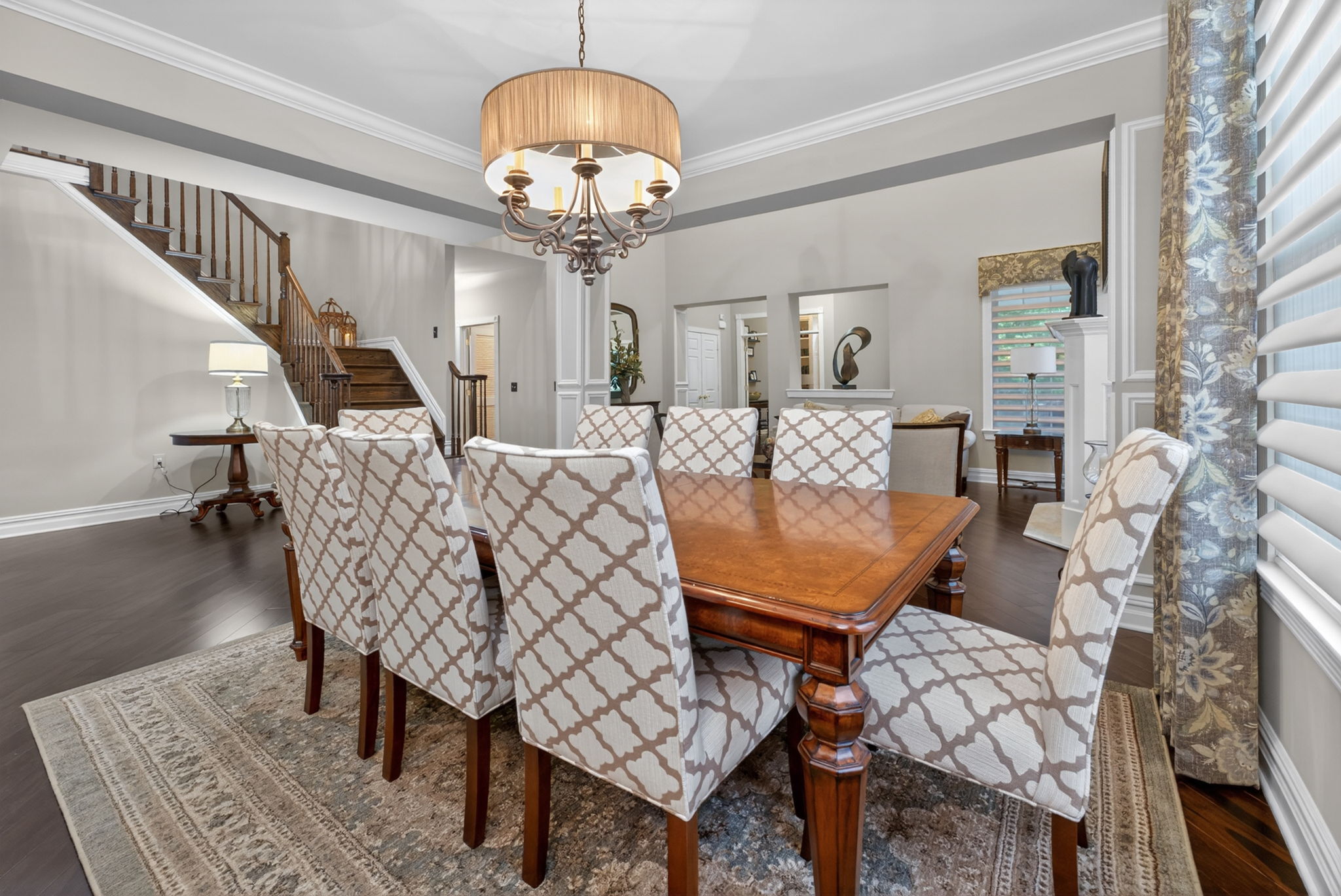 Host elegant dinner parties with confidence in the formal dining room, where elegant lighting creates the perfect ambiance for intimate gatherings.