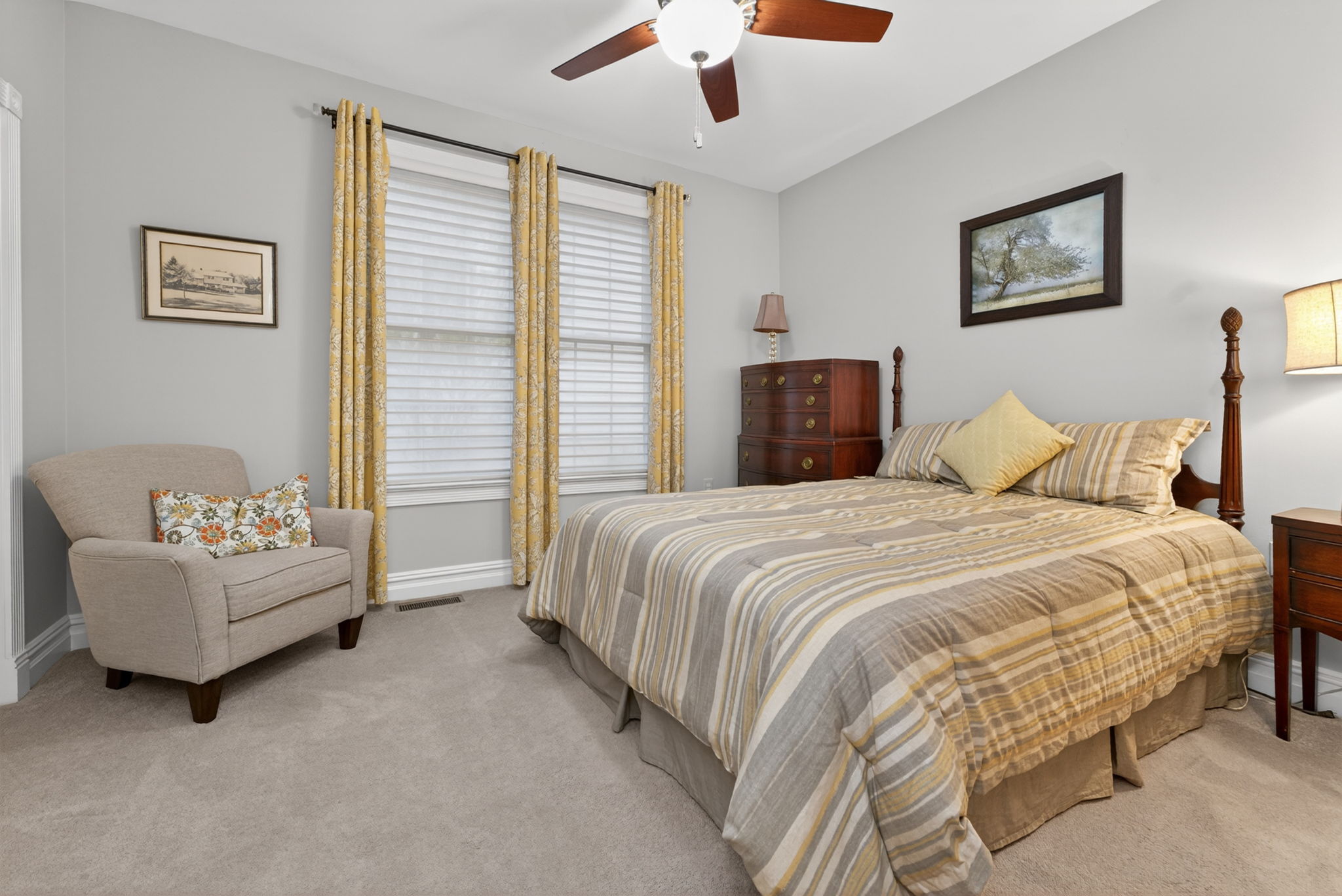 Completing the main level is a second bedroom with its own en suite bath. Additional features include ceiling fan, double door closet and carpeting.