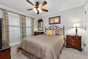 The third bedroom and hall bath offers comfort and privacy for family and overnight guests. Features include crown moulding, ceiling fan, double door closet, and carpeting.
