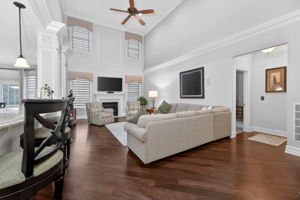 TWO STORY FAMILY ROOM Marble surround fireplaces with custom mantel adds understated sophistication to the dramatic two-story family room. Additional features include recessed lighting, ceiling fan, custom mouldings and wainscoting, 2 story windows.