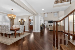 The foyer features a double door closet and hardwood flooring that flows through to the living room, dining room, kitchen, breakfast nook, family room, and study.