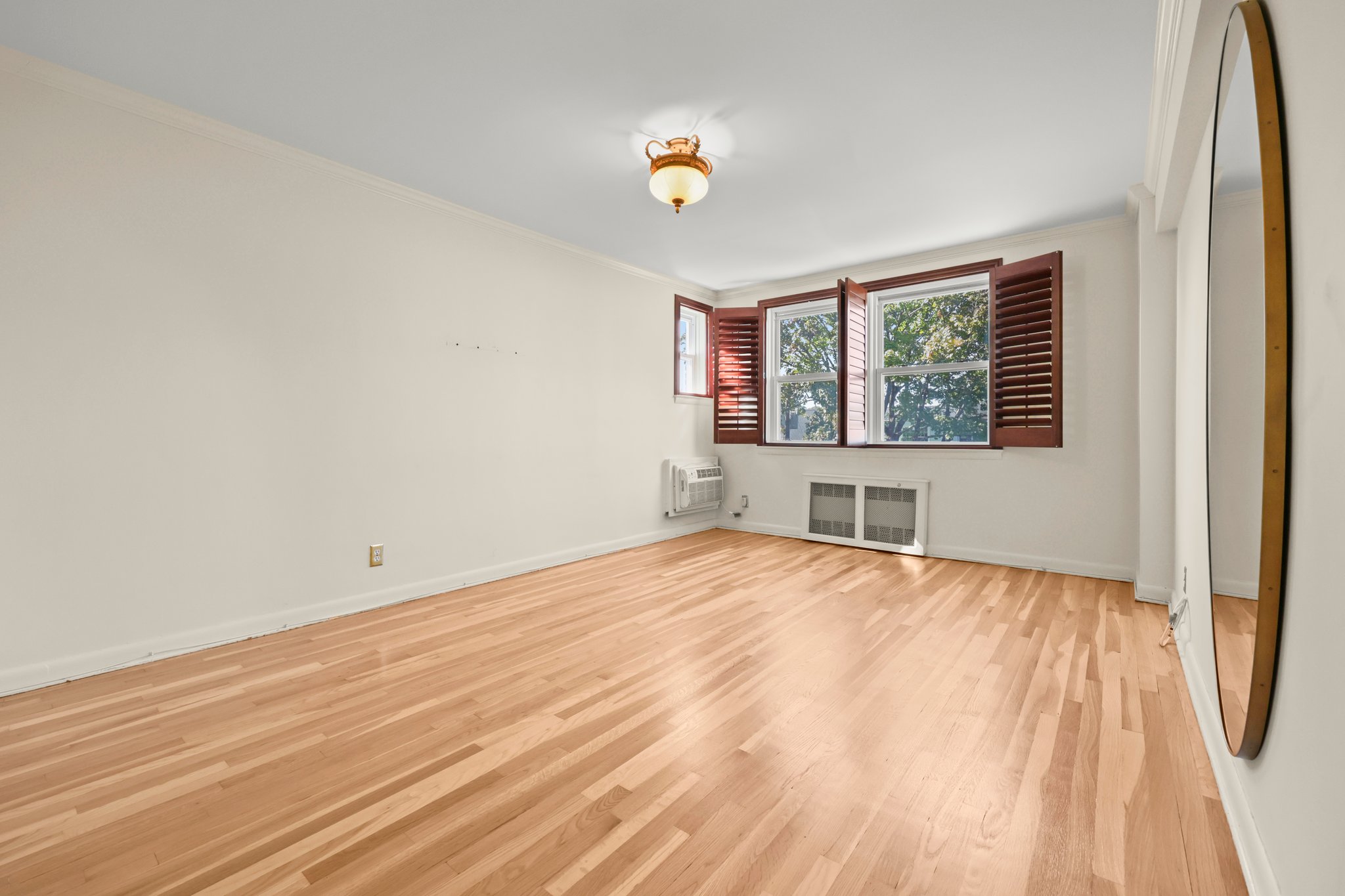 Double Bedroom has 2 closets, custom wood plantation shutters