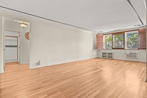 Living Room to Hall. Custom wood plantation shutters.