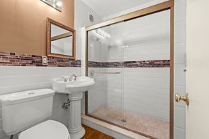 Tiled Bathroom with glassed shower