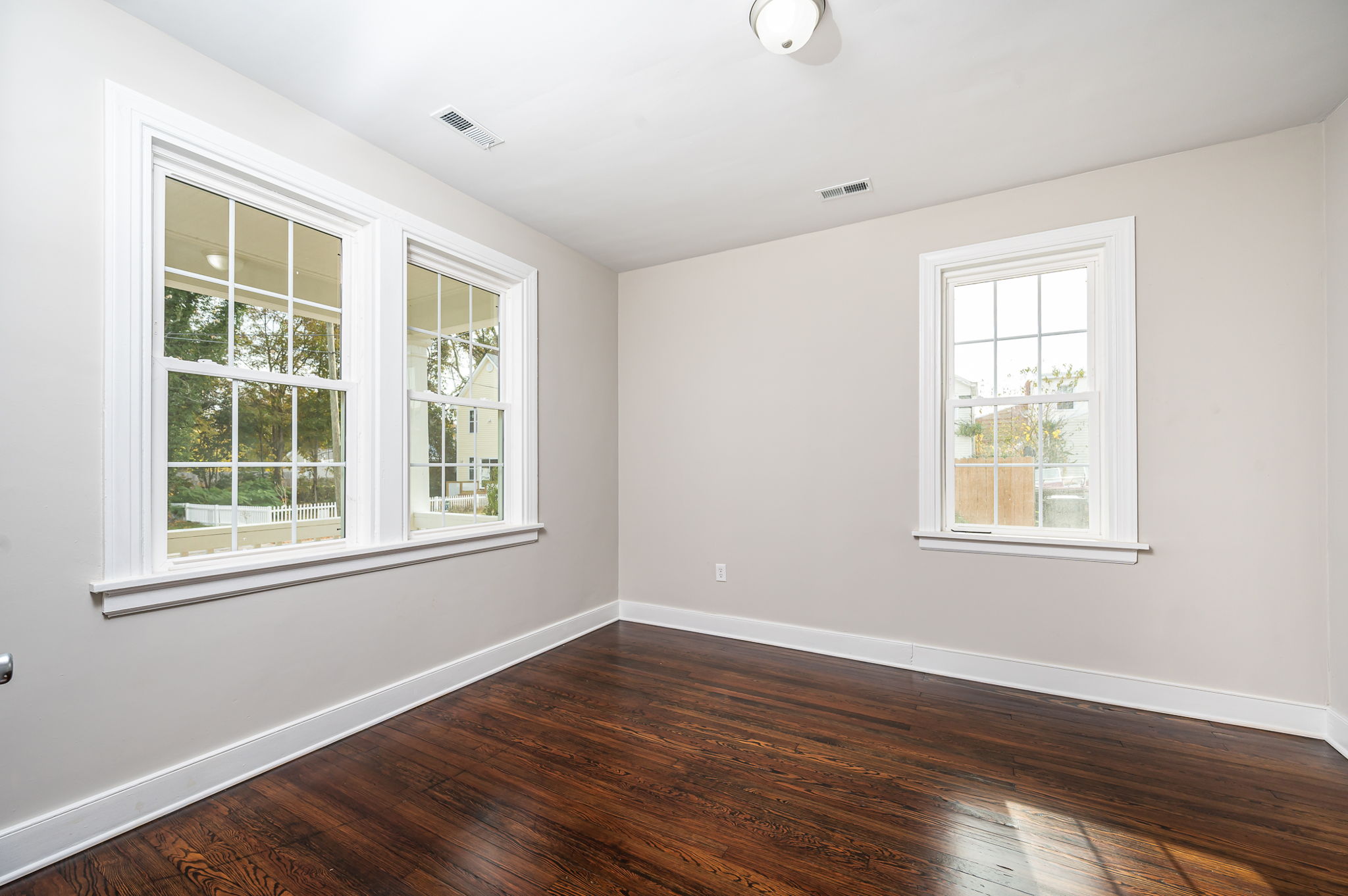 Front bedroom refinished hardwood floors, fresh paint and new lighting fixture