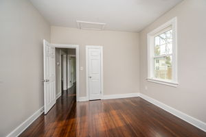 2nd bedroom with refinished hardwood floors, fresh paint and new doors