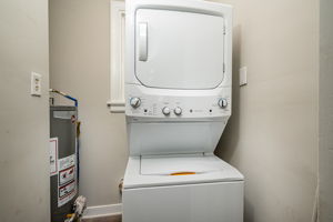 Separate laundry area with brand new washer dryer unit. New water heater