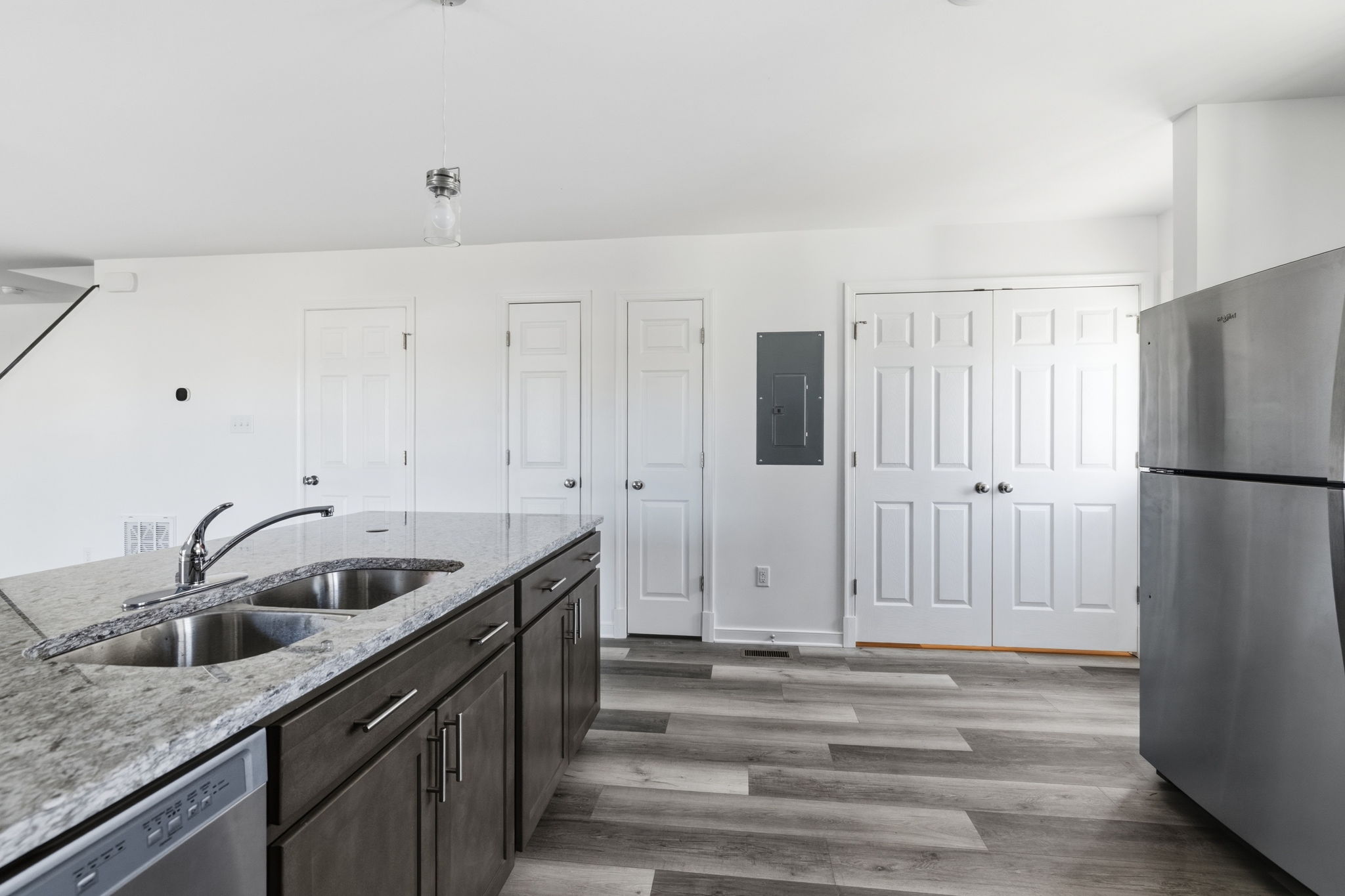 Never miss out on a thing & enjoy entertaining on game day with this seamless integration of the kitchen into the traditional living space.