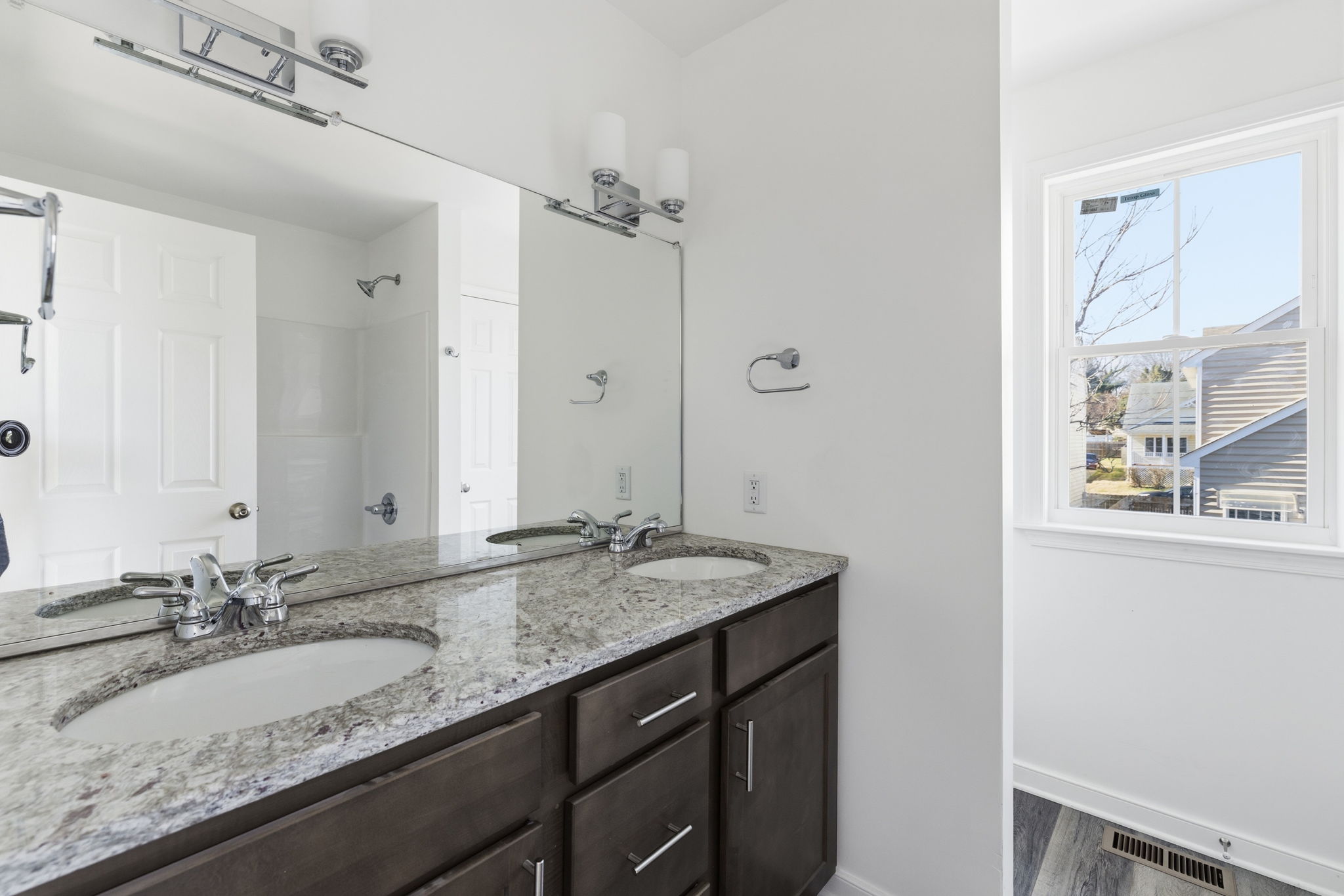 2nd floor hall full bathroom with a dual sink vanity and tub.