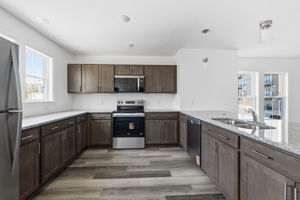 Brand new stainless steel appliances and granite countertops.